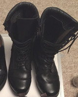 Black combat boots before shine